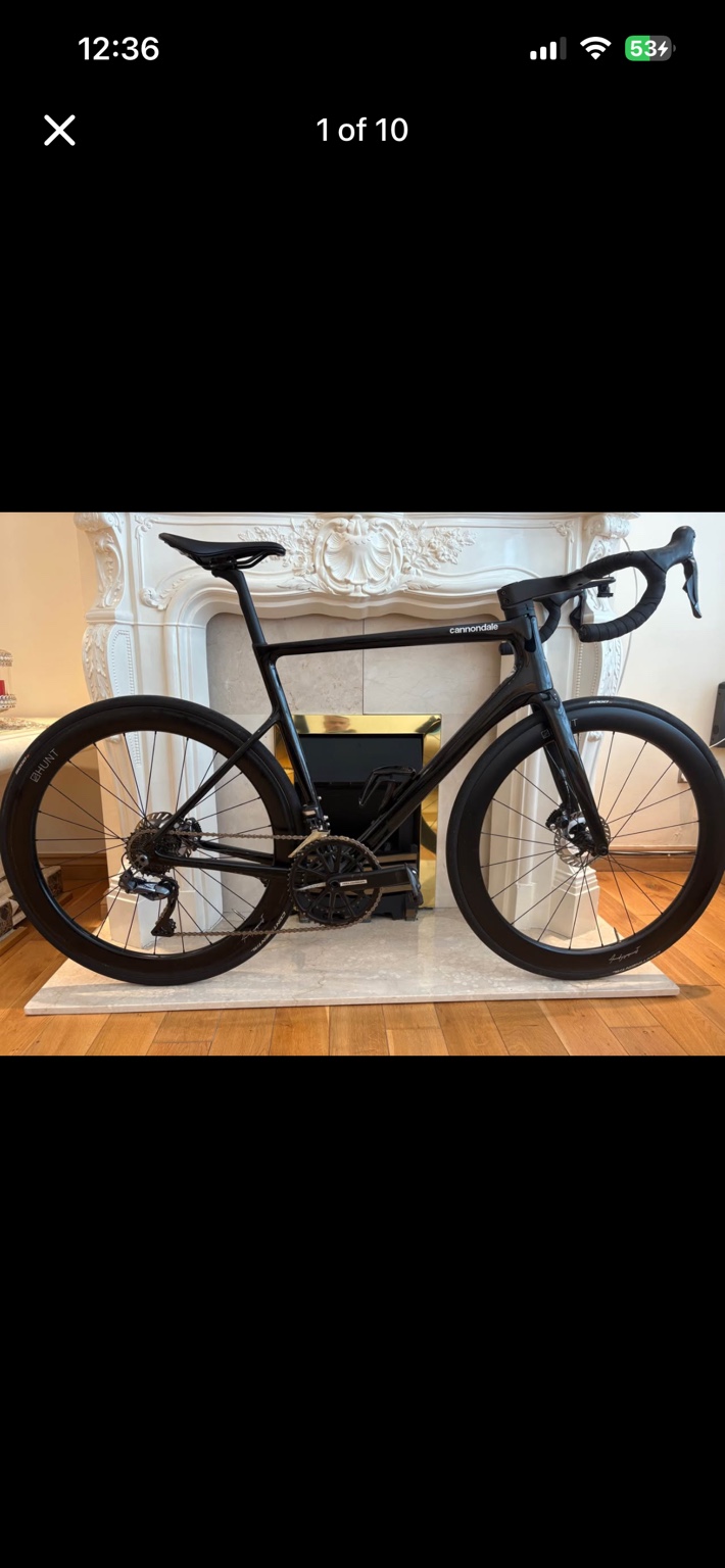 Black Cannondale SuperSix EVO road bike with Hunt carbon wheels, drive-side view