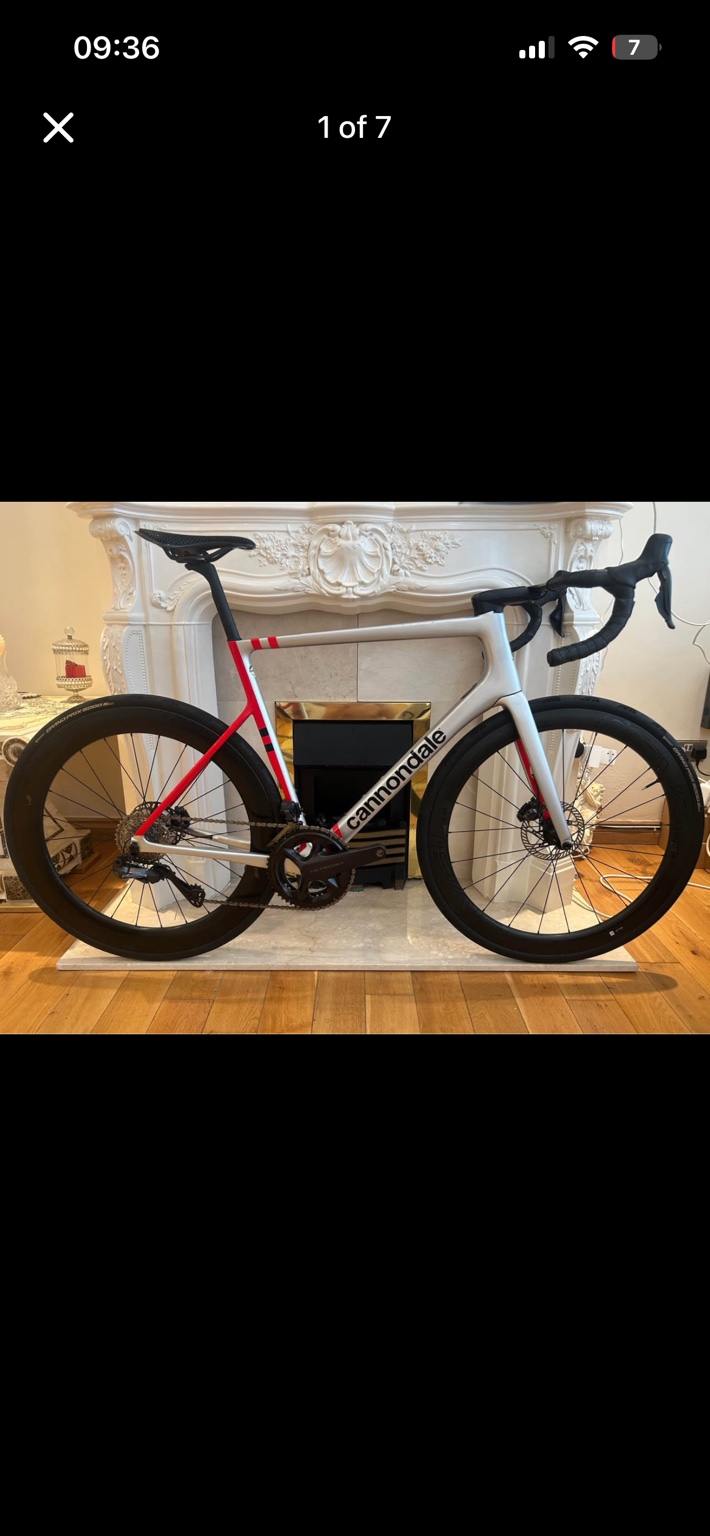 Silver and red Cannondale SuperSix EVO road bike, drive-side view
