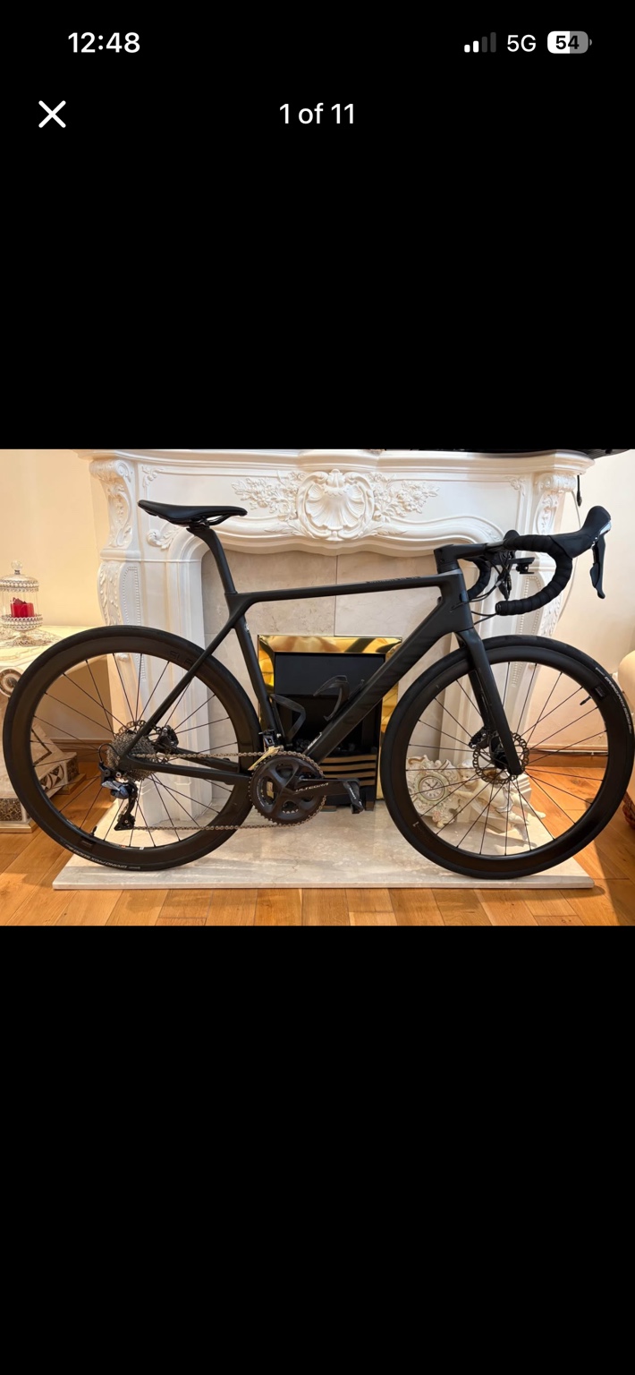 Black Canyon Ultimate CF SLX 9.0 road bike with carbon wheels, drive-side view