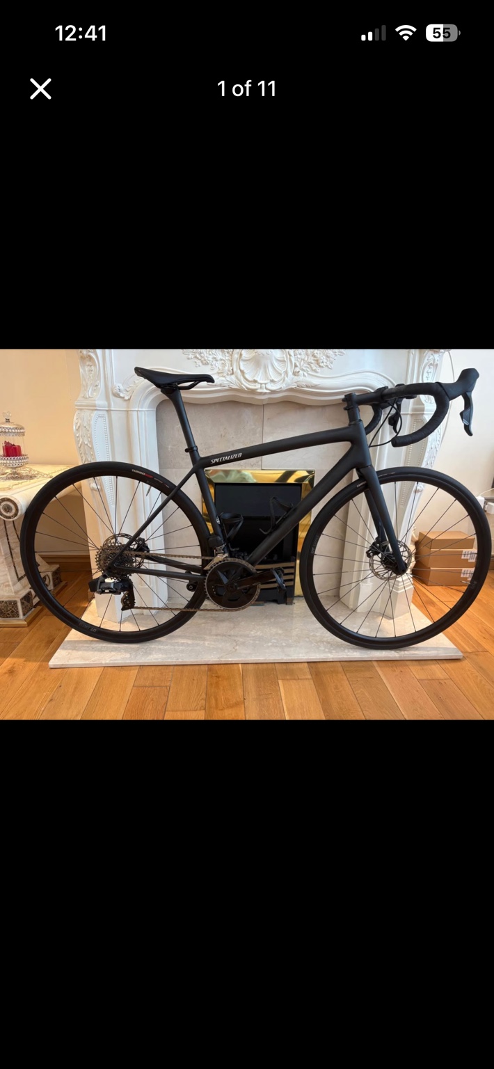 Black Specialized Aethos Comp road bike, drive-side view